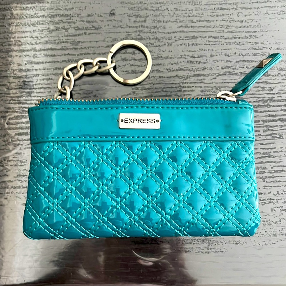 Exquisite teal wallet with key holder/key ring.  Offers welcome